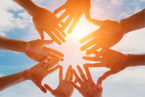 Picture of hands together to symbolize volunteering.