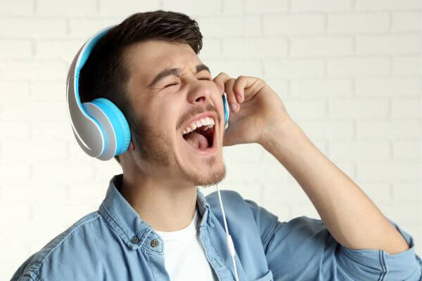 Picture of someone listening to music.