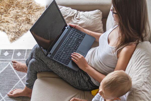 Picture of a lady on a laptop looking at how to get your Amazon refund.