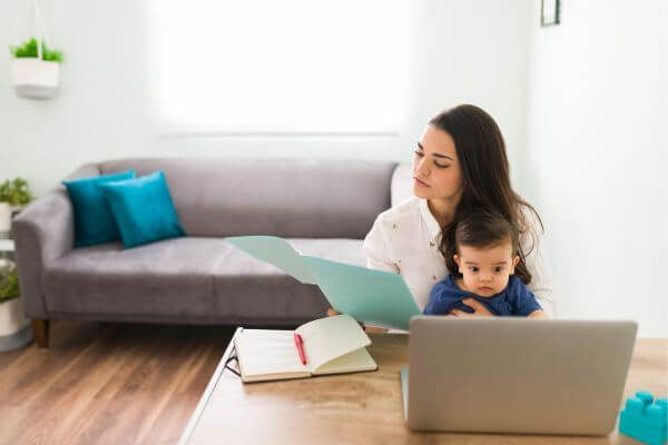 Picture of a mom proofreading a document.