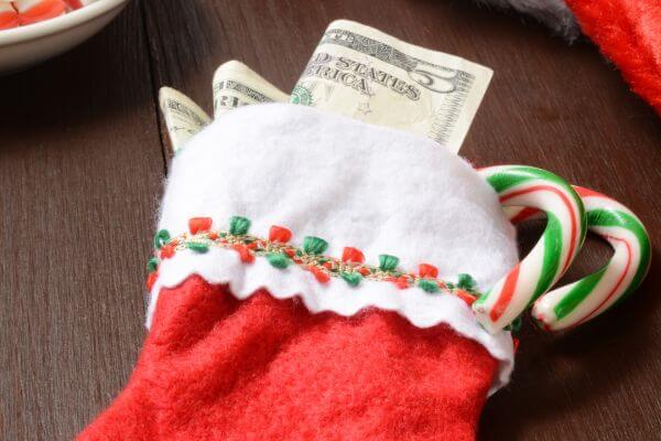 Picture of a stocking and cash for how to make a Christmas budget