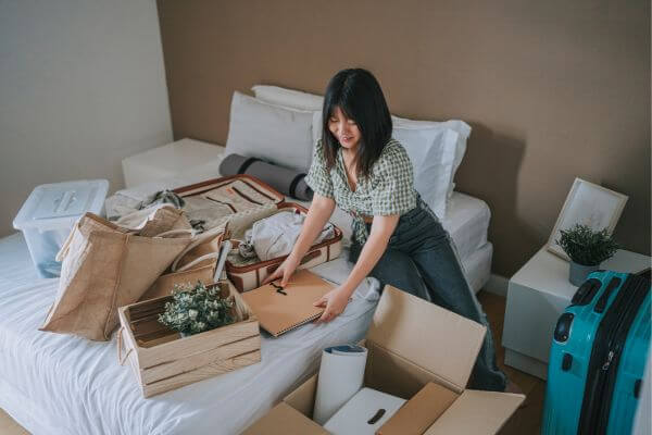 Picture of someone unwrapping one of the care package themes for college students.