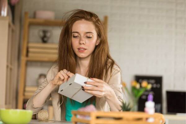 Picture of a girl for what goes in a care package for a college student.