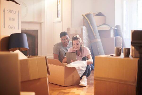 Picture of people unpacking a box.