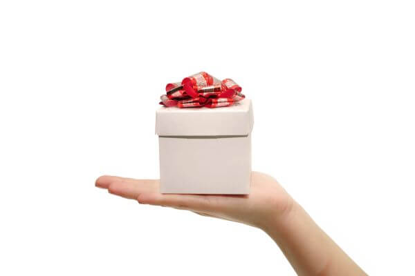 Picture of a hand giving a gift.