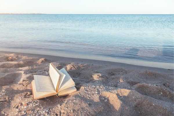 Picture of a book on the beach for how are books life changing.