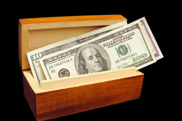 Picture of a money gift box that is wood.