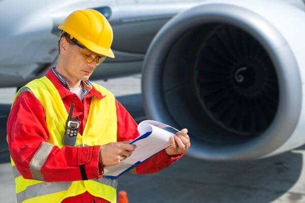 Picture of a flight safety worker checking protocols