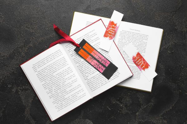 Image of books and bookmarks together in a aesthetic design.