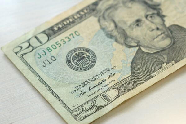 Picture of  the 20 dollar bill if enough for a livable wage for an hour.