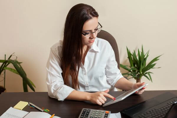 Image of the teacher creating and opening an Etsy shop online to earn extra money.