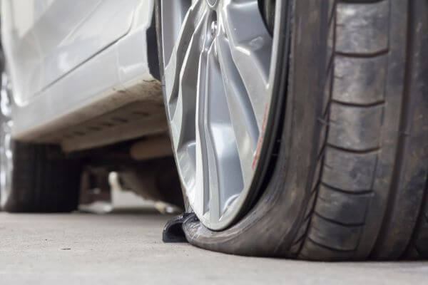 Image of diagnosing a damaged tire and how much it causes.