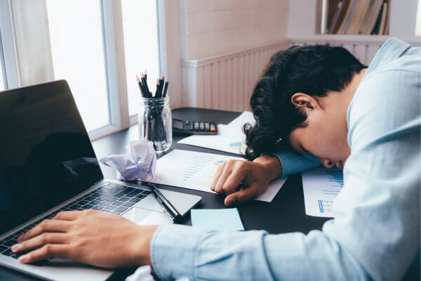 Picture a sick man due to over-fatigue at work and one of the valid reasons to quit a job without notice.