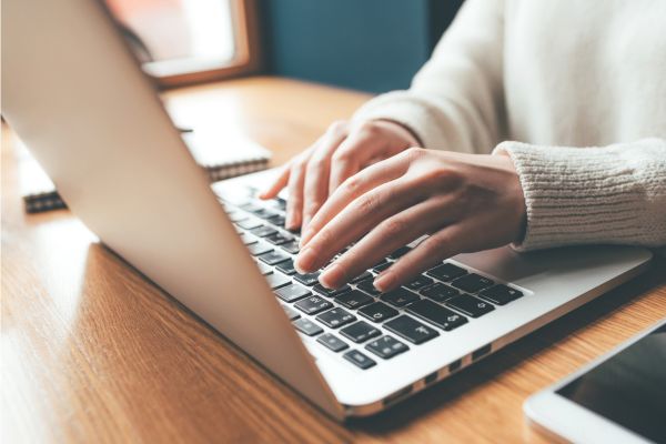 Image of someone typing as remote jobs with high potential income