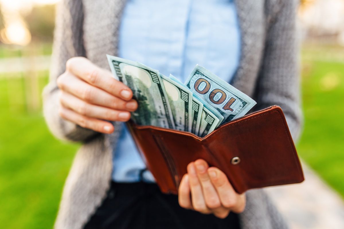 The image shows the dollar bills in the wallet. 