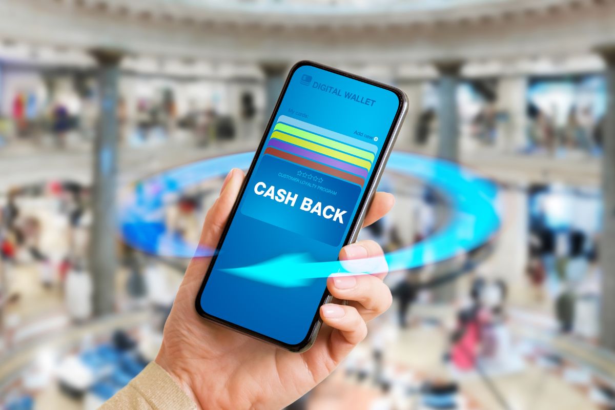A woman's hand using a cash back.