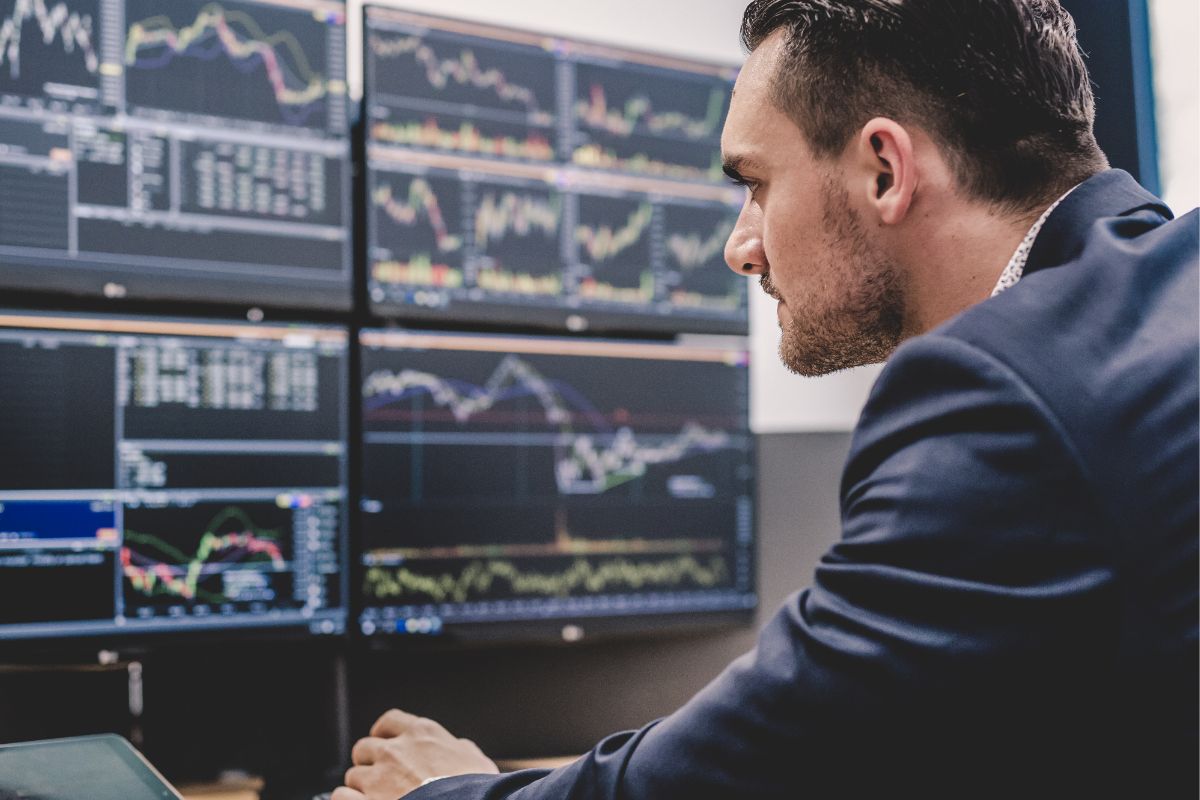 Photo of a man monitoring stocks.