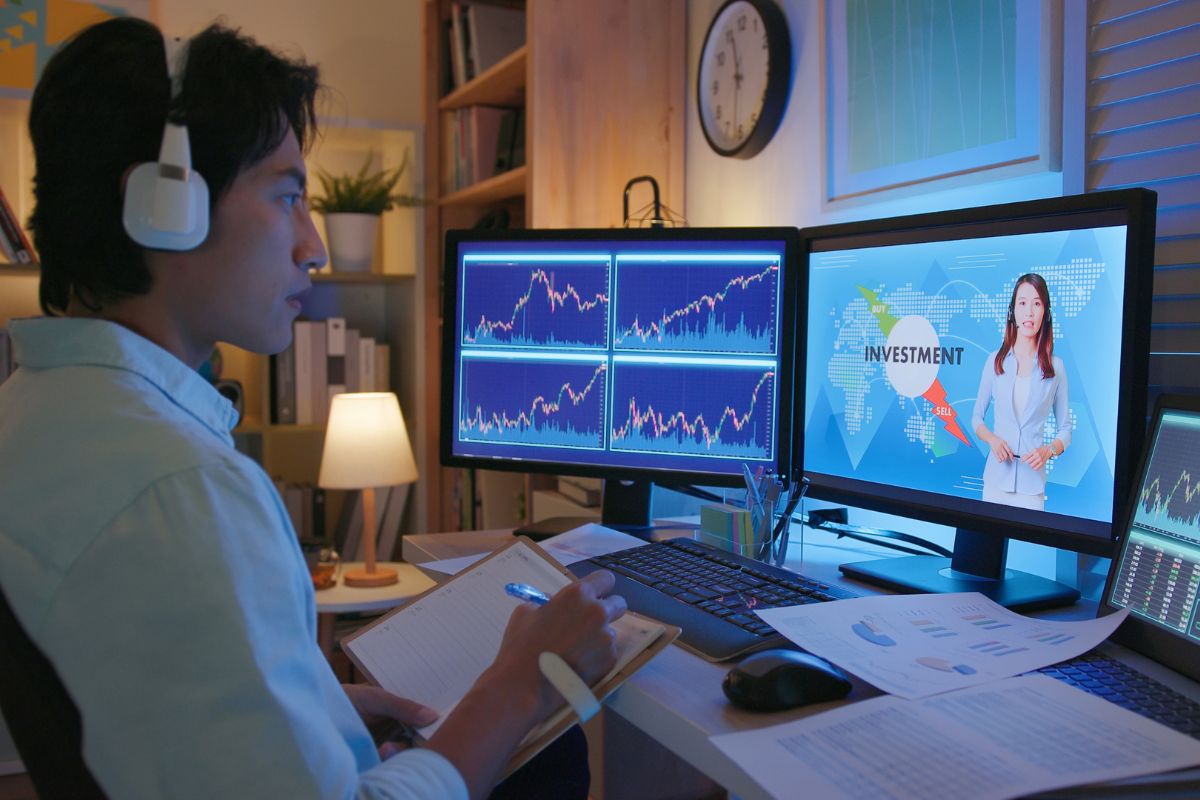 Photo of a man learning investment online.