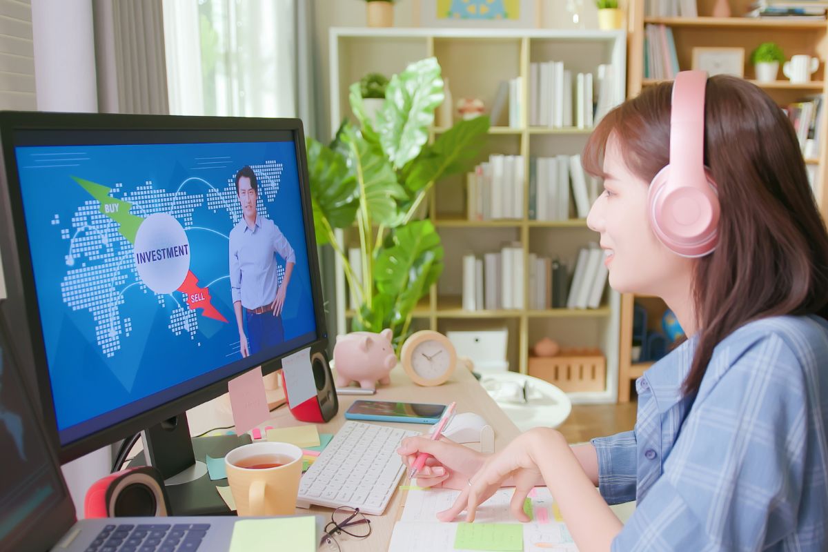 Photo of a woman learning investment online.