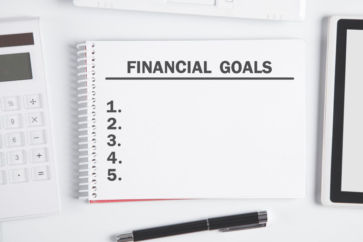 Image of a notebook with financial goals.