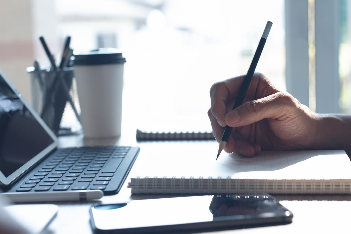 Image of a man's hand learning online.