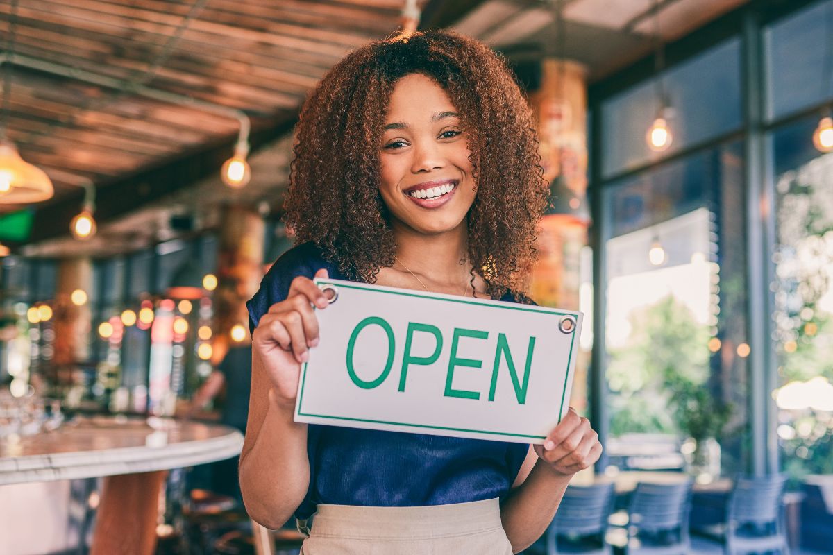 Photo of a woman opening her business.