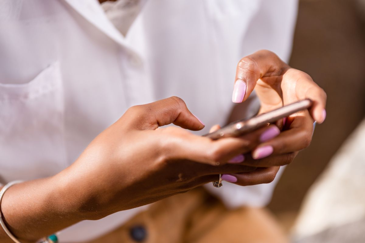Image of a woman's hand canceling her unused subscriptions.