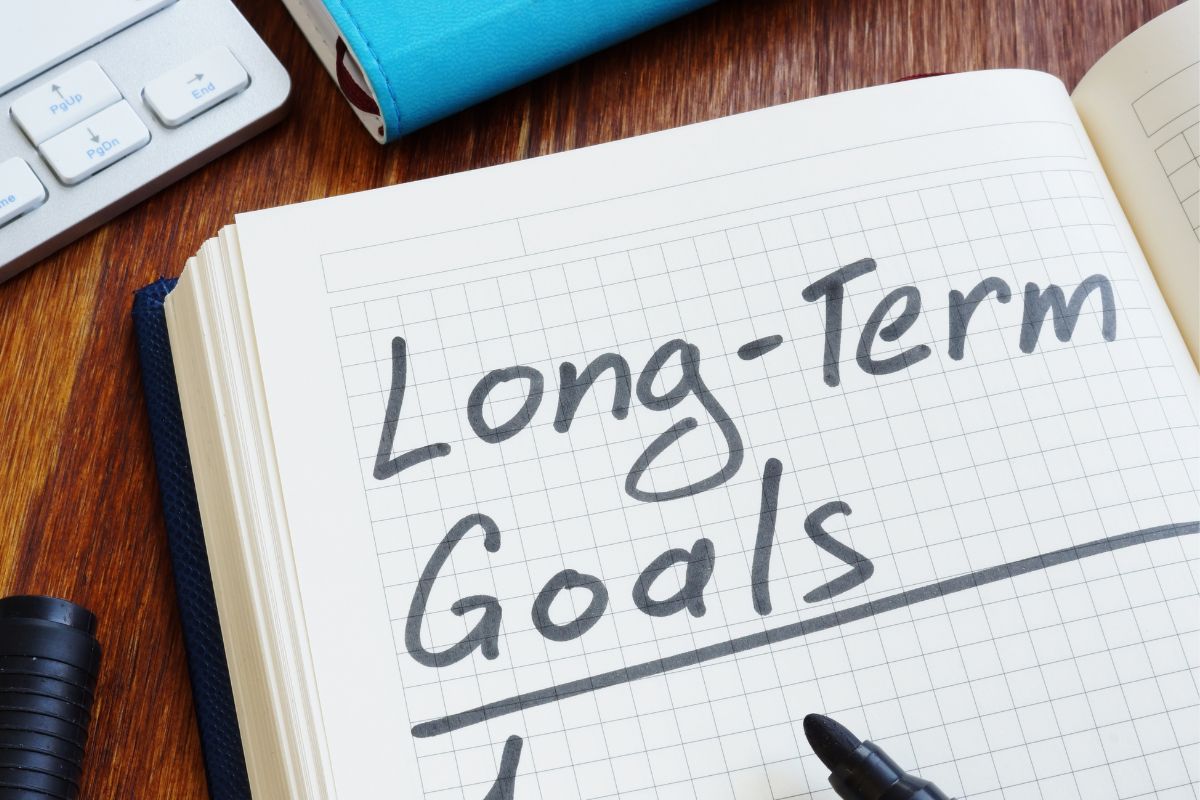 Image of a notebook with long-term goals wording.