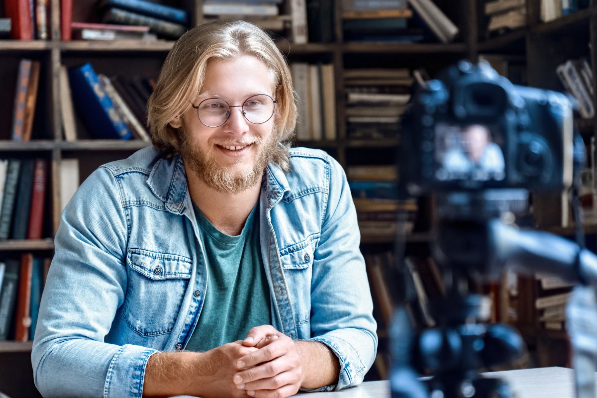 Picture of a man filming himself.
