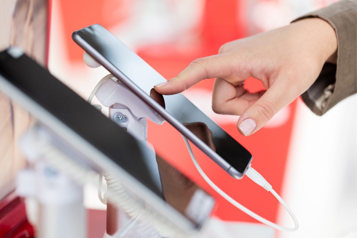 A woman's hand checking for a new phone.