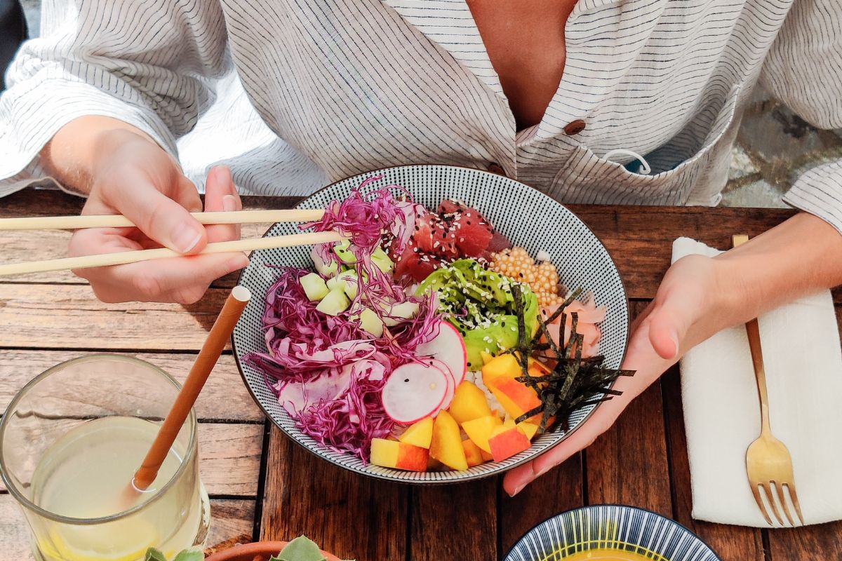 A woman eating a meatless meal.
