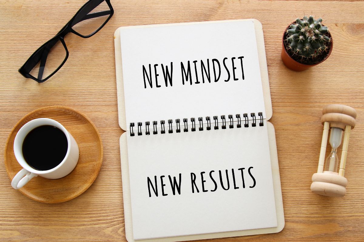 The photo shows a notebook with mindset wording.