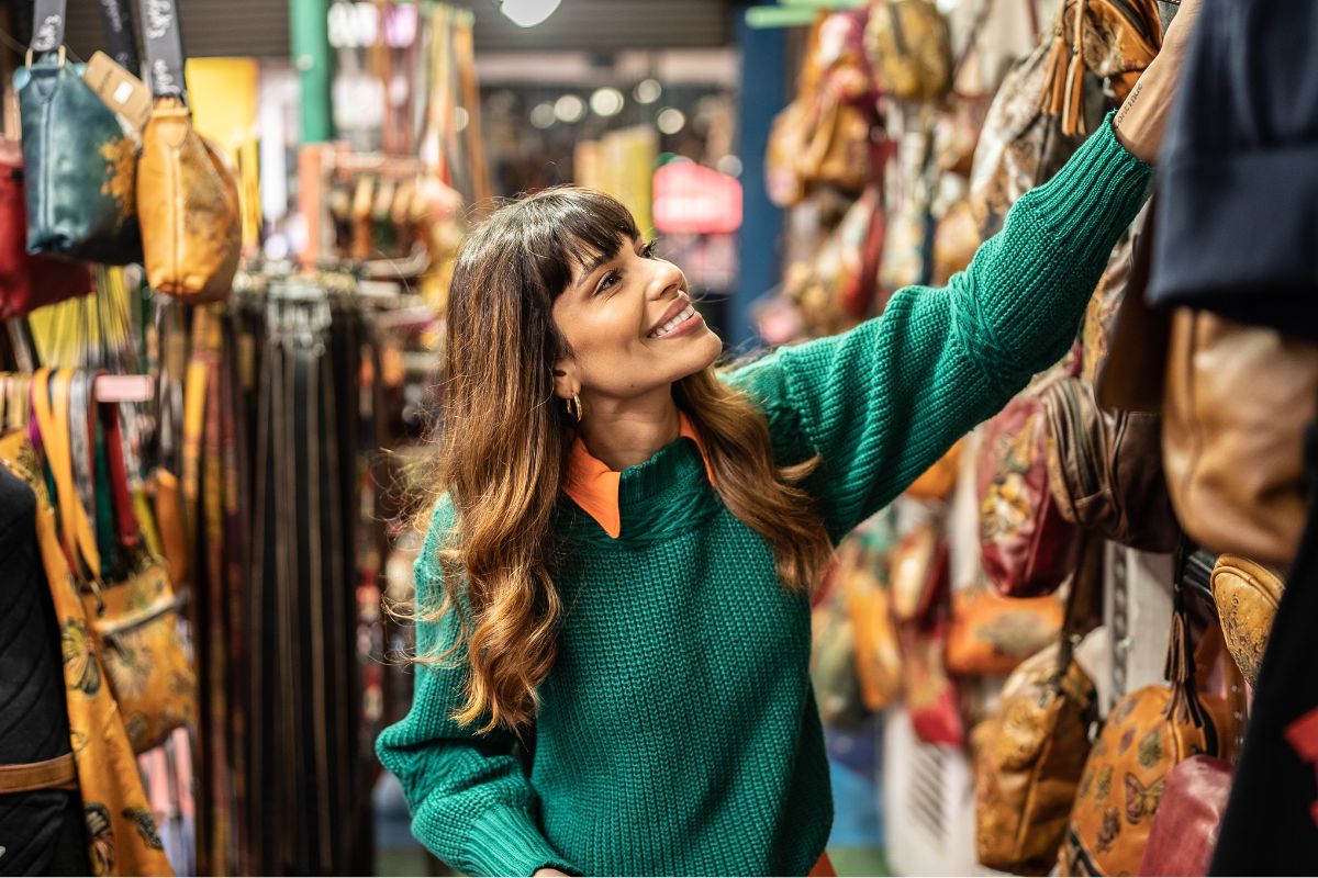Photo of a woman shopping in a thrift store.