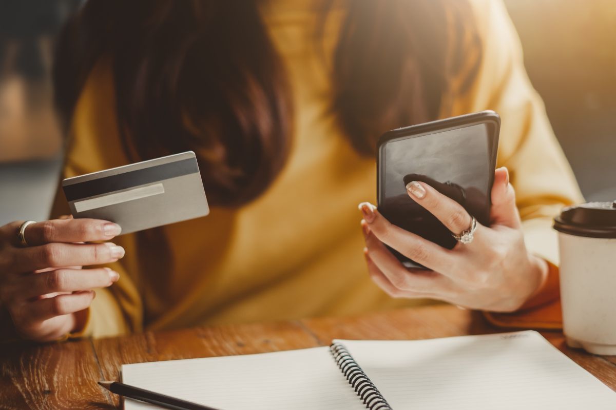 A woman's paying with a credit card online.