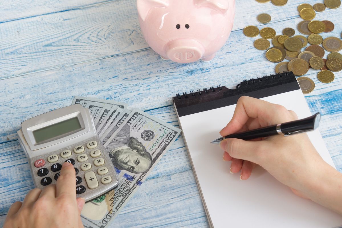 A woman's hand budgeting money.