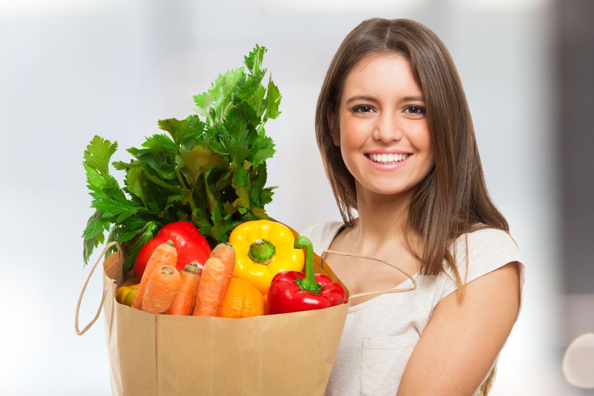 A young lady grocery shopping.