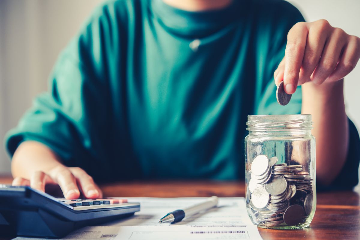 Image of a woman budgeting and saving money.