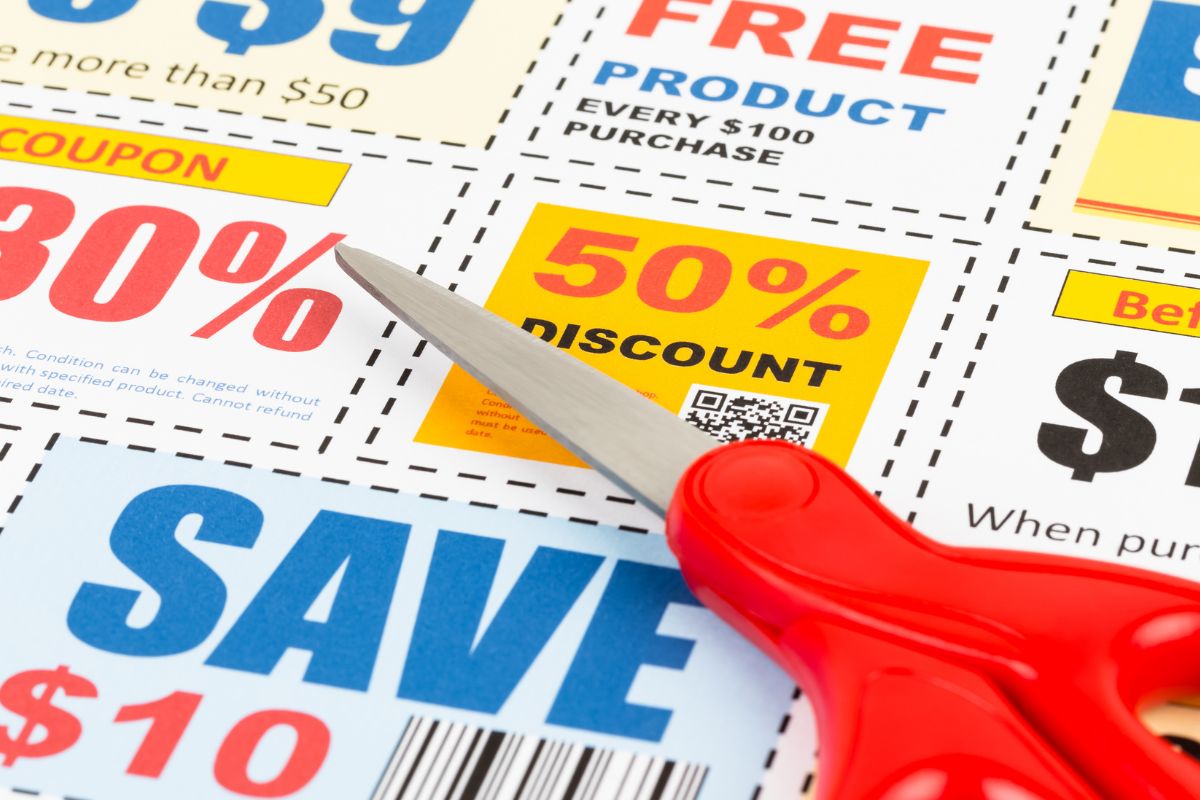 Image of a scissor and coupons.