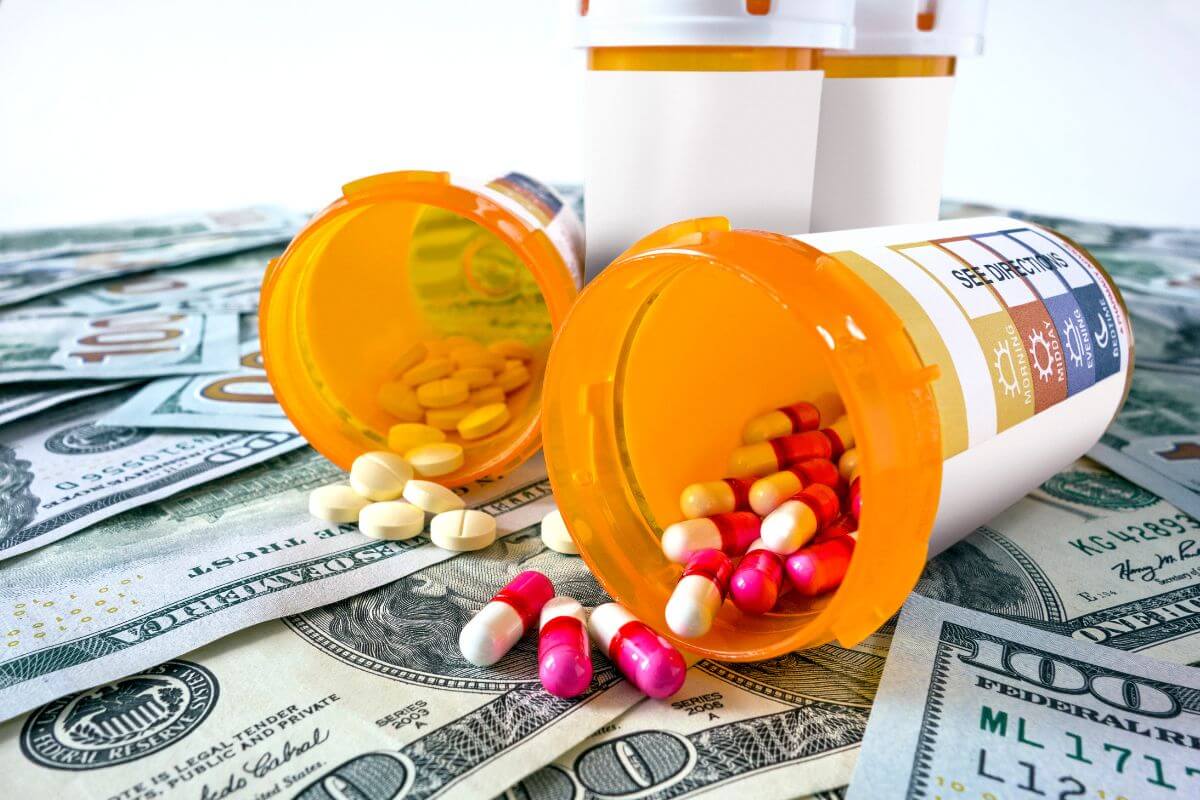 The photo of medicines and dollar bills refers to saving for medical expenses to become financially sound when health issues arise.