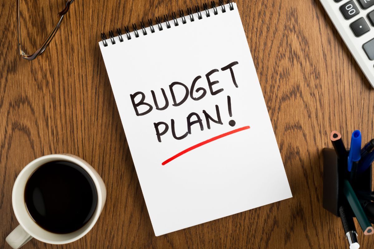 Image of a notebook with budget plan wording.