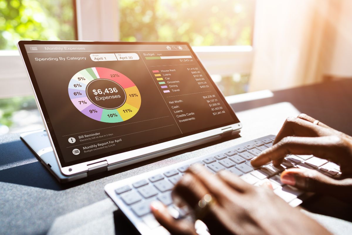 Picture of a woman's hand using a laptop.