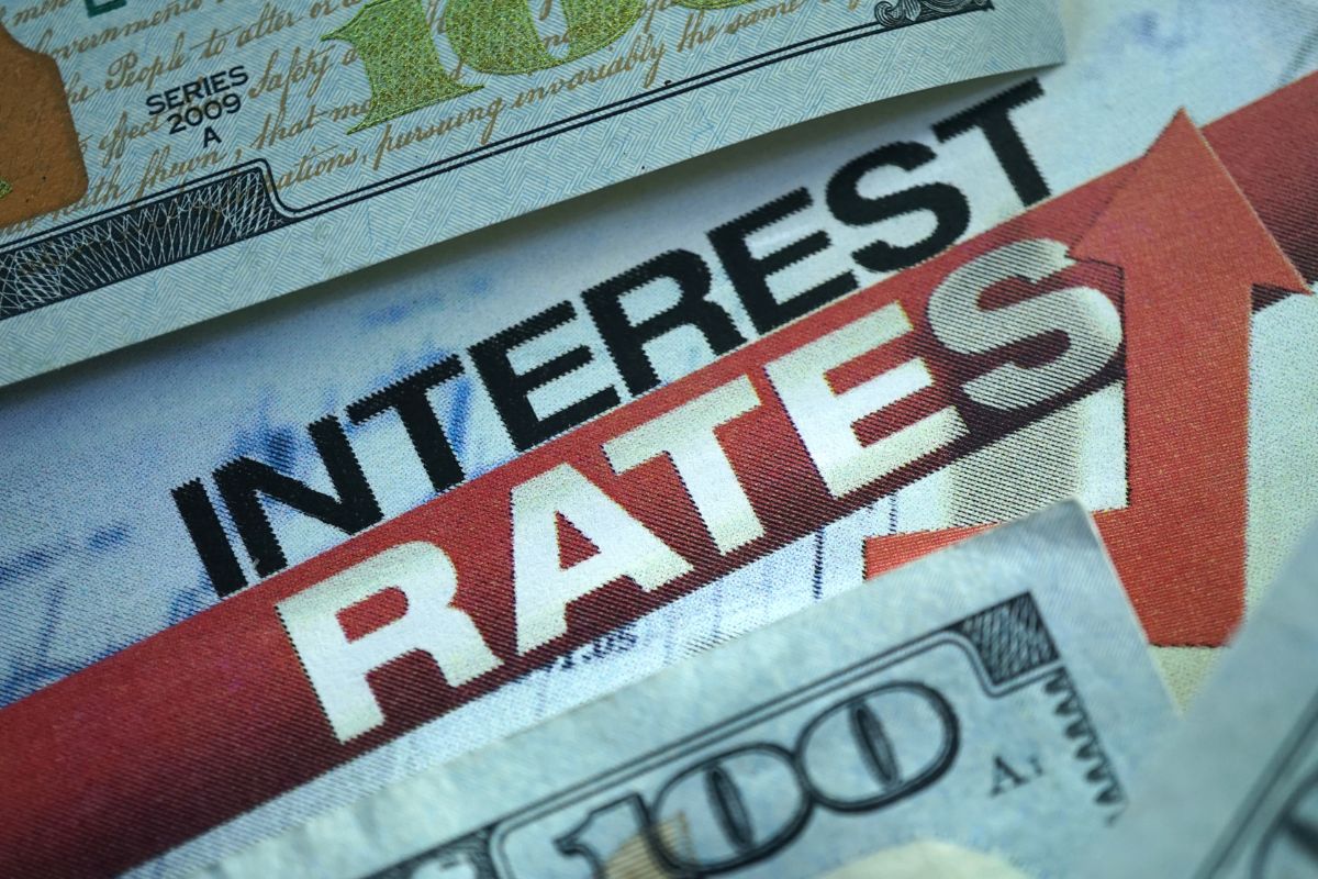 Picture of money and interest rates wording.