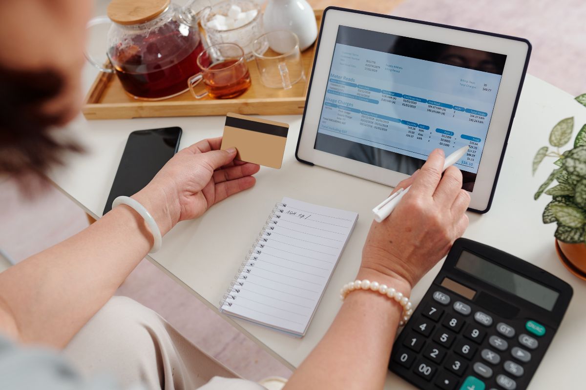 Picture of a woman paying debts online.