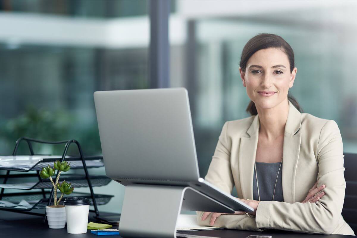 The photo shows the girl with her laptop and phone on the table with high-paying jobs to increase her income.