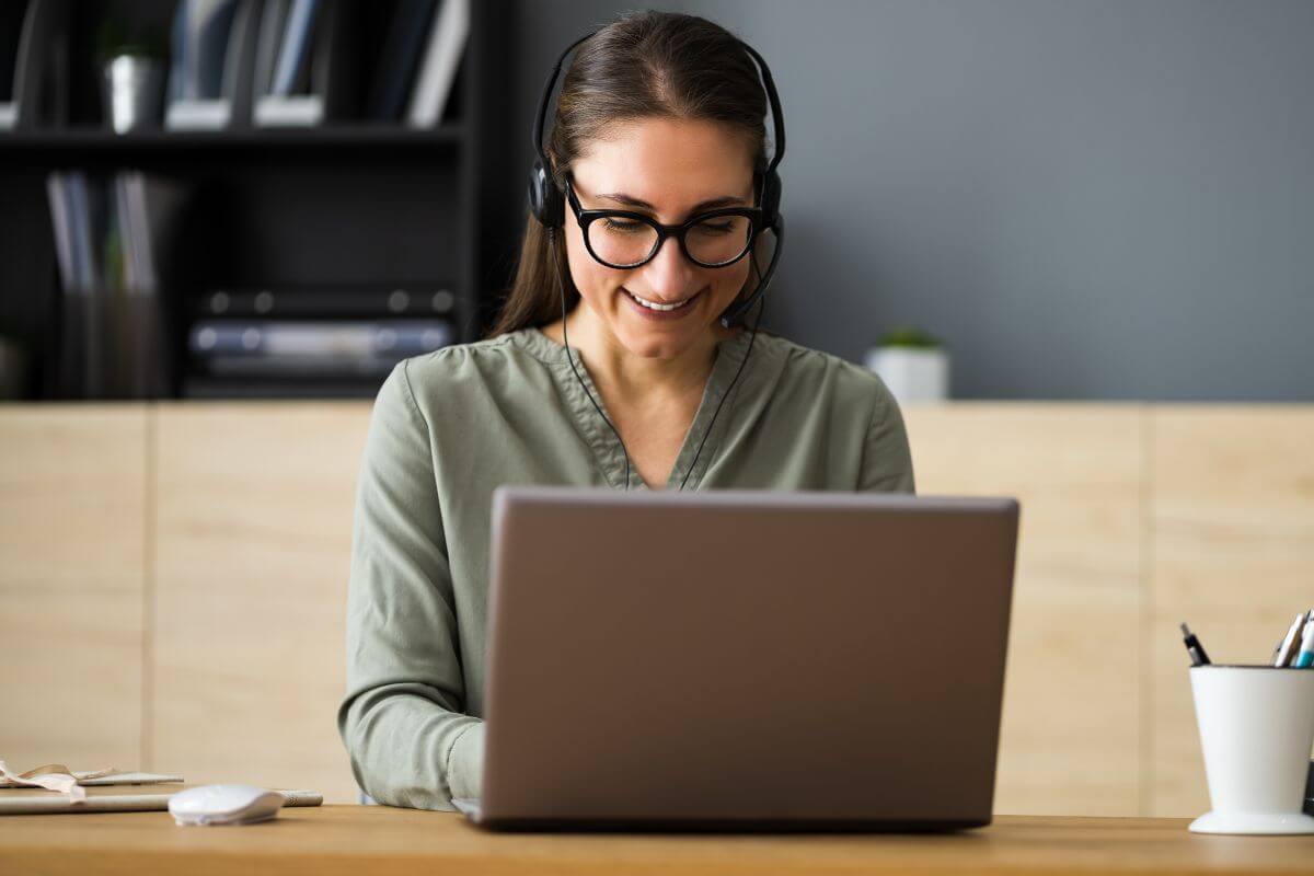 The picture tells about the girl using a laptop to boost her income as a virtual assistant.