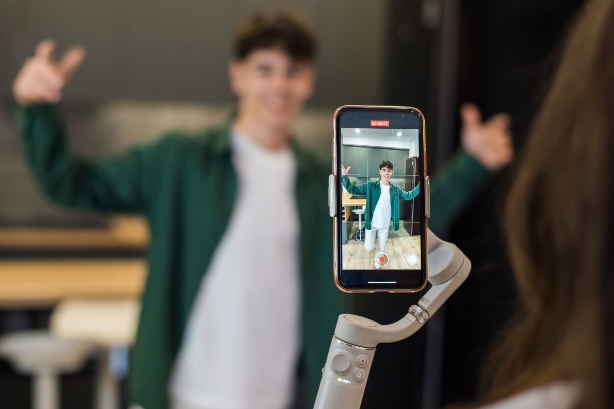 Image of an influencer filming himself.