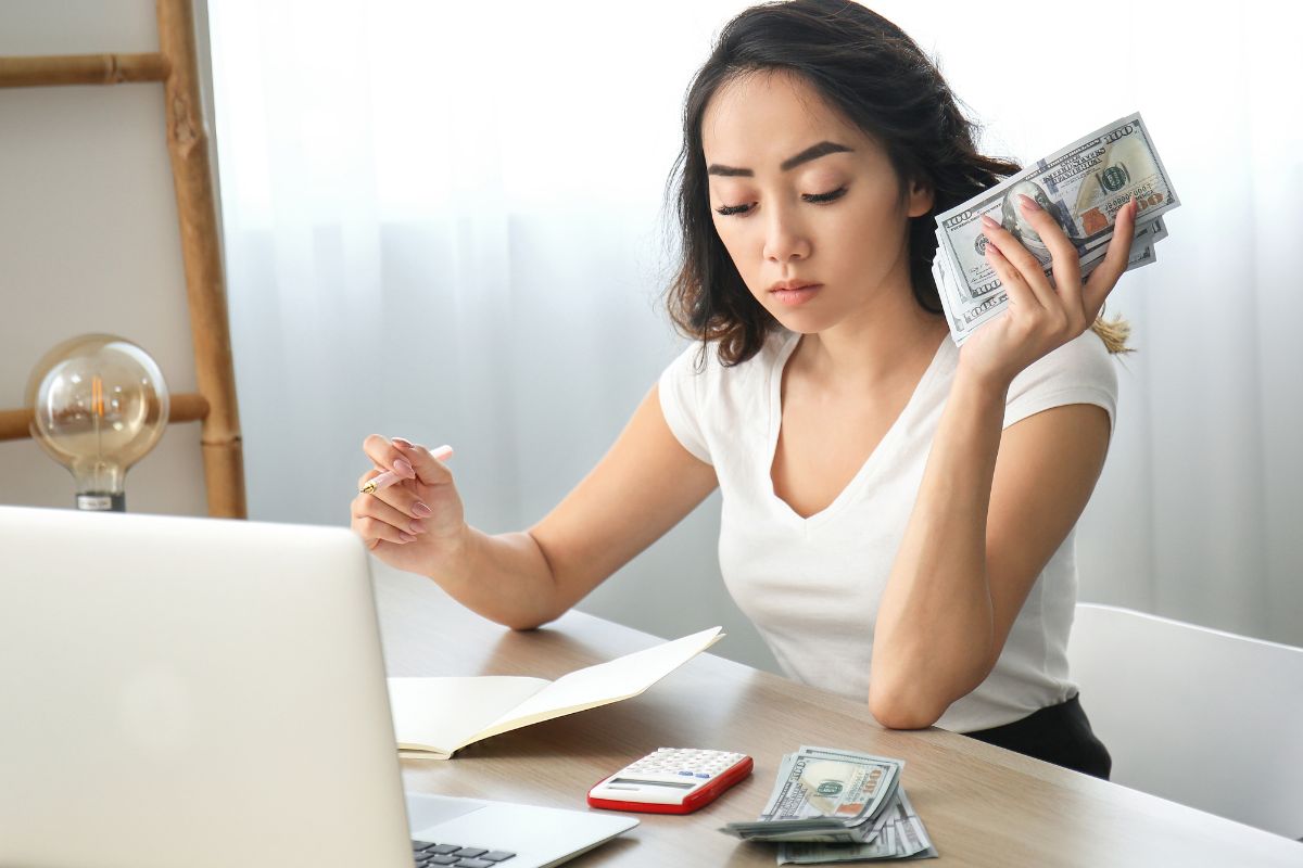 Image of a woman reviewing her finances.