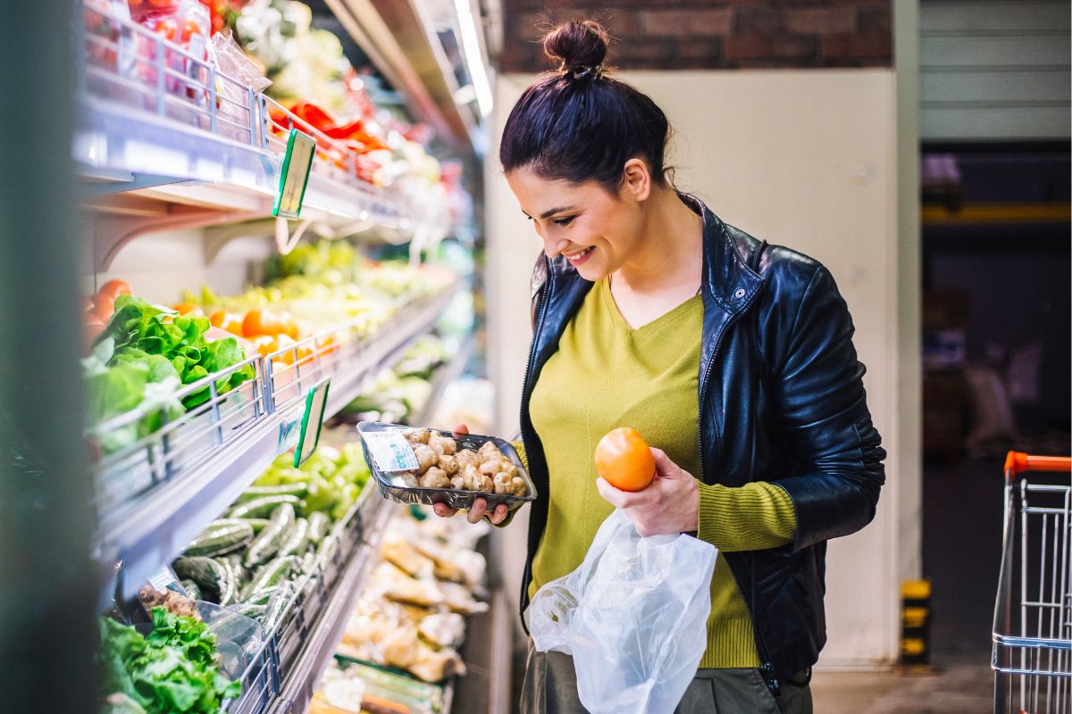 The picture shows a woman shopping for groceries.