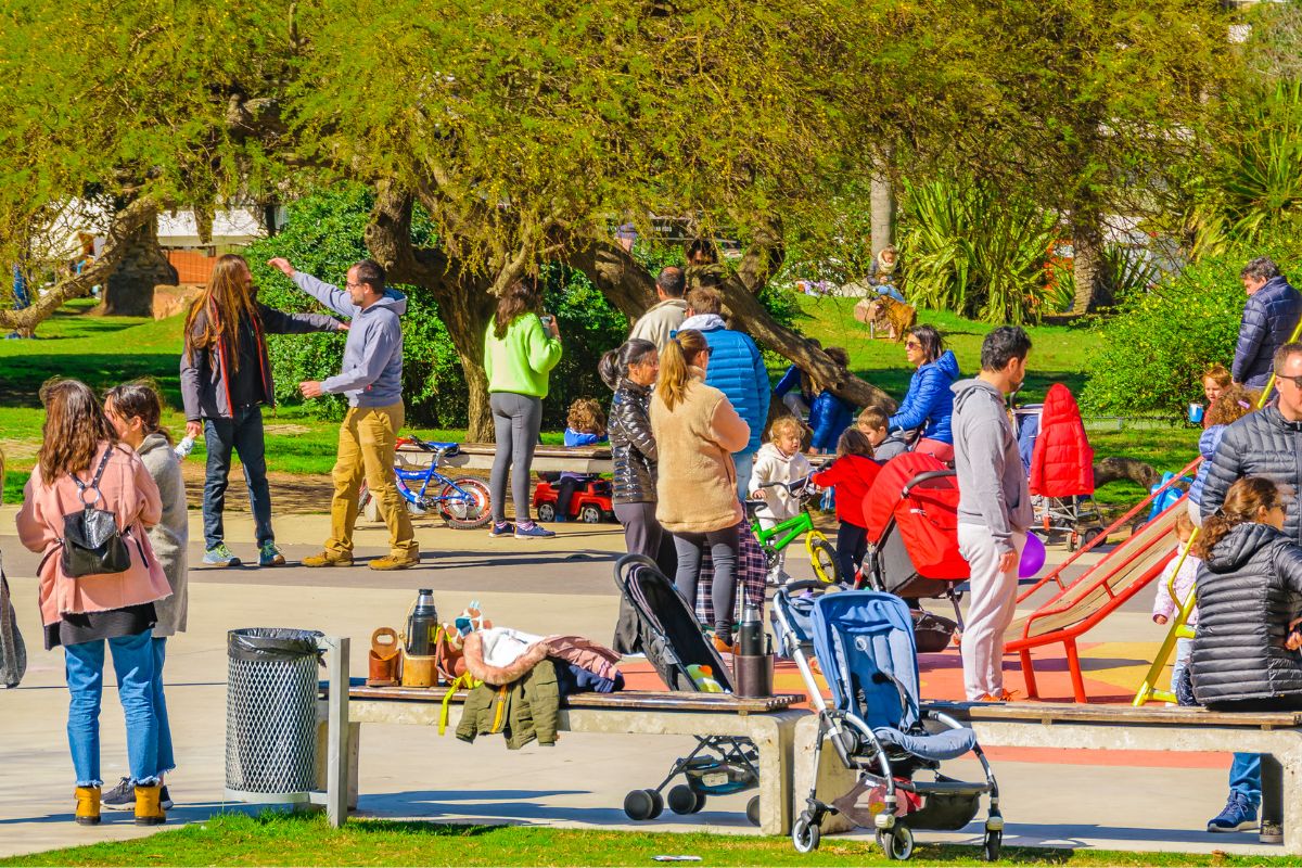 The image shows a group of people at the park.