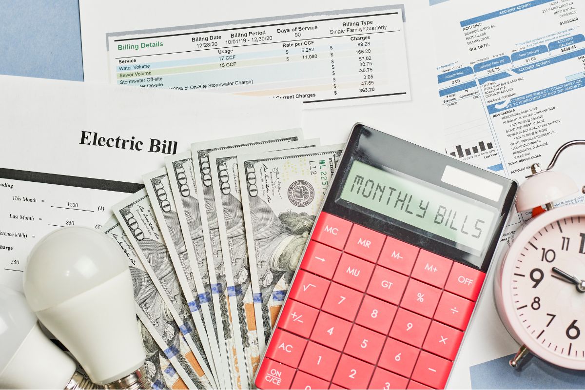 The photo shows monthly bills and money.